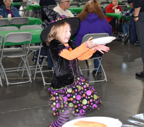 Child catching a pancake.