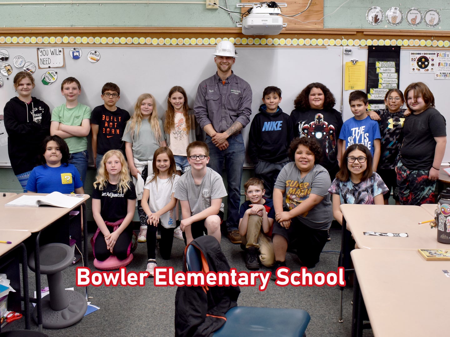 CWEC lineman Wyatt Phillips with the Bowler Elementary School 4th grade class