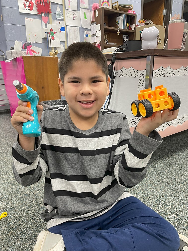 Bowler first graders using STEAM bins.