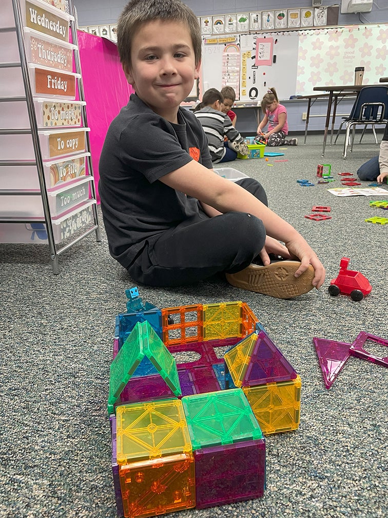 Bowler first graders using STEAM bins.