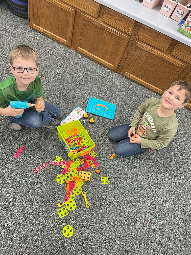 Bowler first graders using STEAM bins.