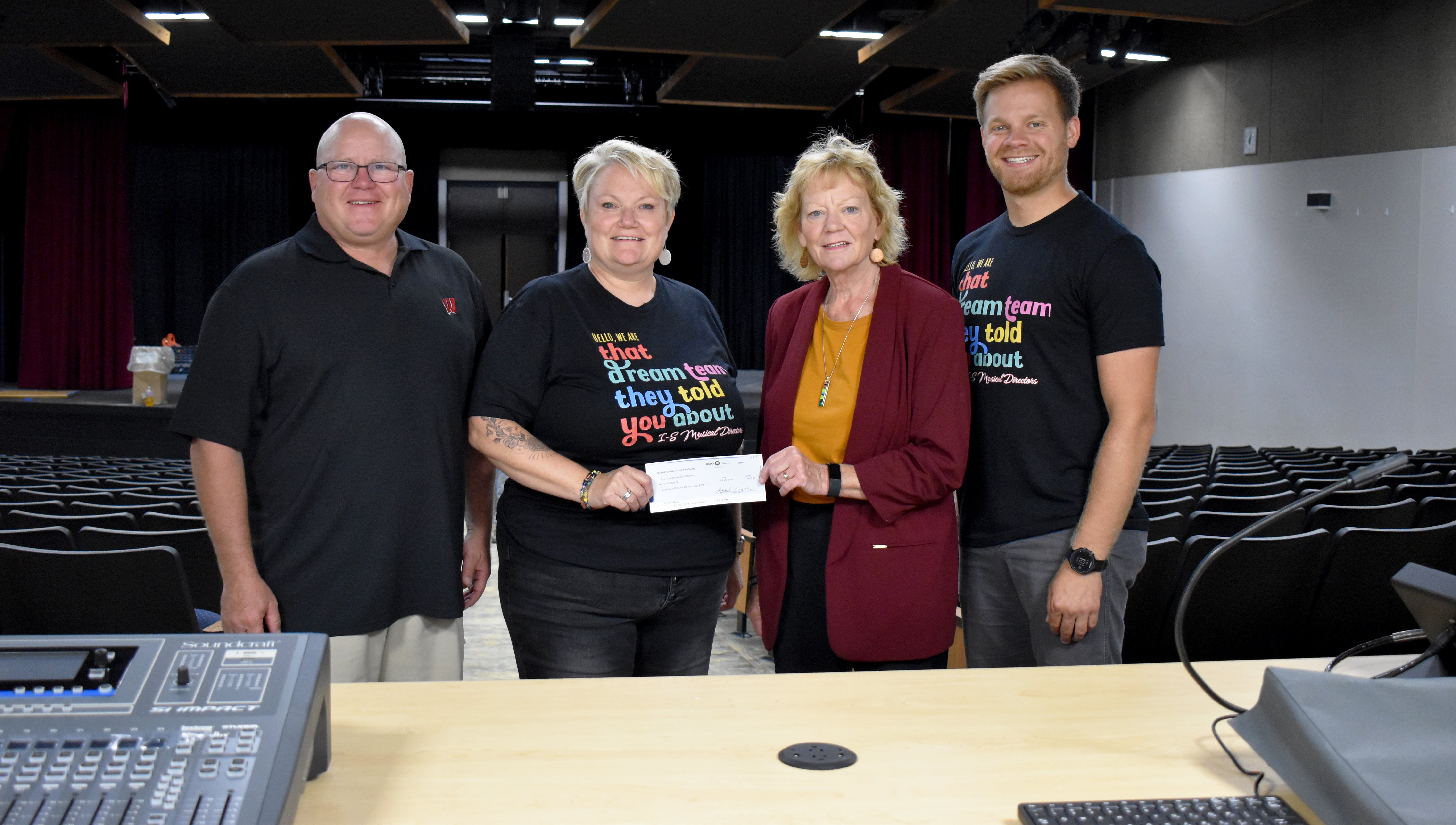 CWEC President & CEO Lila Shower (second from right) presents a $1,000 STEAM grant to Shannon Huettner, high school support instructor at Iola-Scandinavia High School, and part of the team who heads up the district’s musical each year (second from left), Dale Bestul (far left), and Zach Shulfer, general music teacher for grades 4-6 and chorus teacher for grades 7-12 in the Iola-Scandinavia School District. (far right). 